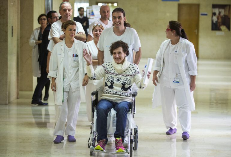 FILE - In this Wednesday, Nov. 5, 2014 file photo, Teresa Romero, bottom right, arrives with medical workers to give a press statement before she leaves the Carlos III hospital in Madrid, Spain. A Spanish nursing assistant who recovered from Ebola has been discharged from a Madrid hospital a month after she was admitted with the virus. She was the first person known to have contracted the disease outside of West Africa in the latest outbreak. Hospital doctors said Romero, 44, received various treatments, including blood plasma from an Ebola survivor, but were unable to say if any had been effective. Romero had treated two Spanish missionaries who died of Ebola in August and September after they were flown back from West Africa. Doctors said she will be able to live a normal life and poses no contamination risk. (AP Photo/Andres Kudacki, File) FILE - In this Wednesday, Nov. 5, 2014 file photo, Teresa Romero, bottom right, arrives with medical workers to give a press statement before she leaves the Carlos III hospital in Madrid, Spain. A Spanish nursing assistant who recovered from Ebola has been discharged from a Madrid hospital a month after she was admitted with the virus. She was the first person known to have contracted the disease outside of West Africa in the latest outbreak. Hospital doctors said Romero, 44, received various treatments, including blood plasma from an Ebola survivor, but were unable to say if any had been effective. Romero had treated two Spanish missionaries who died of Ebola in August and September after they were flown back from West Africa. Doctors said she will be able to live a normal life and poses no contamination risk. (AP Photo/Andres Kudacki, File)