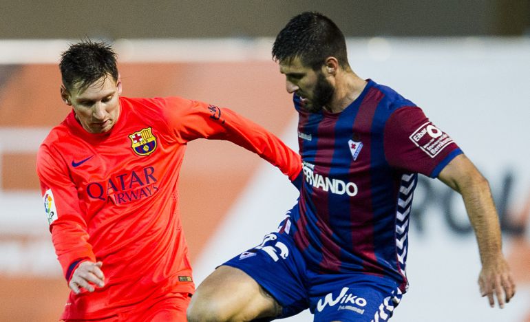 EIBAR, SPAIN - MARCH 14: Lionel Messi (R) of FC Barcelona duels for the ball with Raul Rodriguez Navas of SD Eibar during the La Liga match between SD Eibar and FC Barcelona at Ipurua Municipal Stadium on March 14, 2015 in Eibar, Spain. (Photo by Juan Manuel Serrano Arce/Getty Images) EIBAR, SPAIN - MARCH 14: Lionel Messi (R) of FC Barcelona duels for the ball with Raul Rodriguez Navas of SD Eibar during the La Liga match between SD Eibar and FC Barcelona at Ipurua Municipal Stadium on March 14, 2015 in Eibar, Spain. (Photo by Juan Manuel Serrano Arce/Getty Images)