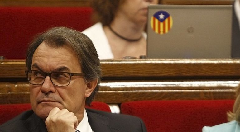 President of the Catalunya Generalitat regional government Artur Mas sits during a control sesion of the Catalan Parliament in Barcelona on June 18, 2015. The junior party in the coalition that runs Catalonia said yesterday that its three ministers were pulling out of the regional government due to disagreements over its push to break away from Spain. AFP PHOTO / QUIQUE GARCIA President of the Catalunya Generalitat regional government Artur Mas sits during a control sesion of the Catalan Parliament in Barcelona on June 18, 2015. The junior party in the coalition that runs Catalonia said yesterday that its three ministers were pulling out of the regional government due to disagreements over its push to break away from Spain. AFP PHOTO / QUIQUE GARCIA
