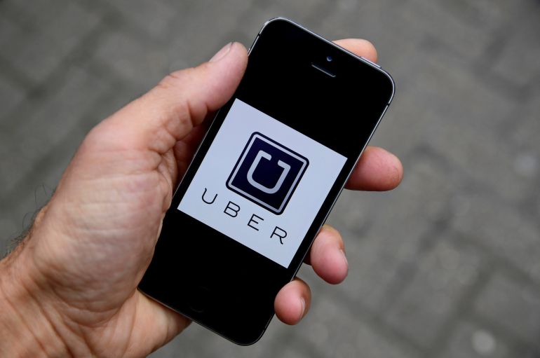 La aplicación de Uber en un teléfono móvil La aplicación de Uber en un teléfono móvil