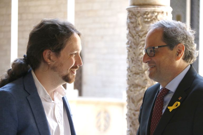 El president de la Generalitat, Quim Torra, y el líder de Podemos, Pablo Iglesias, cara a cara, poco antes de iniciar su reunión El president de la Generalitat, Quim Torra, y el líder de Podemos, Pablo Iglesias, cara a cara, poco antes de iniciar su reunión