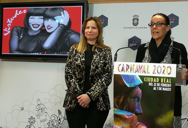 Frasi López, presidenta de la Federación de Peñas, a la izquierda y Eva María Masías, concejal de Festejos, a la derecha. De fondo, cartel de las pregoneras, Las Virtudes Frasi López, presidenta de la Federación de Peñas, a la izquierda y Eva María Masías, concejal de Festejos, a la derecha. De fondo, cartel de las pregoneras, Las Virtudes