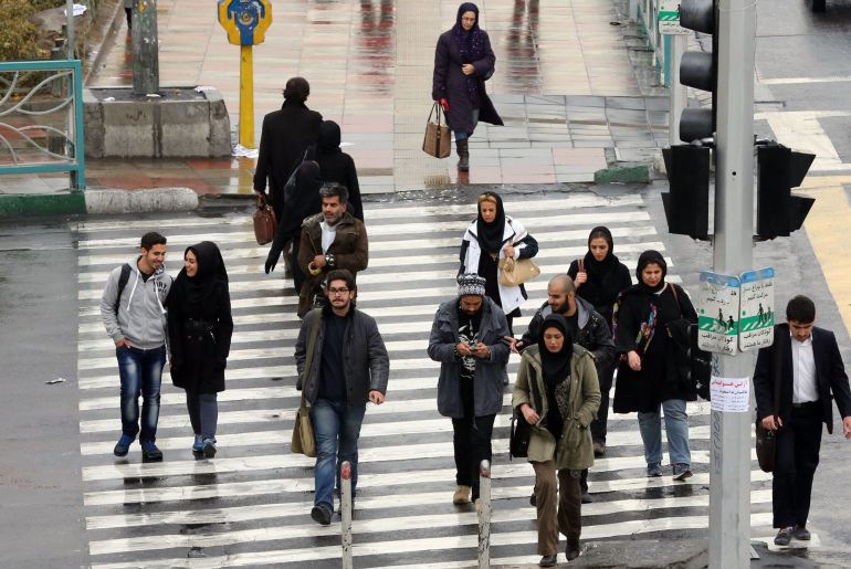 Iranians walk on a street in the capital Tehran on November 25, 2014. Supreme leader Ayatollah Ali Khamenei said that Iran would not sink "to its knees" over its disputed nuclear programme, his first comment since a missed deadline for a deal. Iran and world powers announced on November 24 that talks on a comprehensive nuclear agreement had been inconclusive and would be extended until June 30 next year. AFP PHOTO/ ATTA KENARE Iranians walk on a street in the capital Tehran on November 25, 2014. Supreme leader Ayatollah Ali Khamenei said that Iran would not sink "to its knees" over its disputed nuclear programme, his first comment since a missed deadline for a deal. Iran and world powers announced on November 24 that talks on a comprehensive nuclear agreement had been inconclusive and would be extended until June 30 next year. AFP PHOTO/ ATTA KENARE
