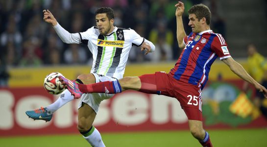Moenchengladbach's Alvaro Dominguez from Spain, left, and Bayern's Thomas Mueller challenge for the ball during the German Bundesliga soccer match between Borussia Moenchengladbach and Bayern Munich in Moenchengladbach, Germany, Sunday, Oct. 26, 2014. (AP Photo/Martin Meissner) Moenchengladbach's Alvaro Dominguez from Spain, left, and Bayern's Thomas Mueller challenge for the ball during the German Bundesliga soccer match between Borussia Moenchengladbach and Bayern Munich in Moenchengladbach, Germany, Sunday, Oct. 26, 2014. (AP Photo/Martin Meissner)