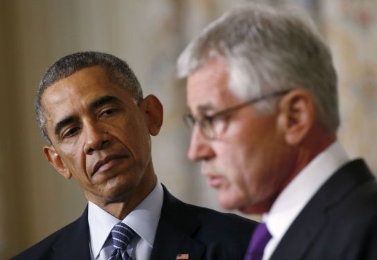 U.S. President Barack Obama (L) listens to Defense Secretary Chuck Hagel after the president announced Hagel's resignation at the White House in Washington, November 24, 2014. REUTERS/Kevin Lamarque (UNITED STATES - Tags: MILITARY POLITICS TPX IMAGES OF THE DAY) U.S. President Barack Obama (L) listens to Defense Secretary Chuck Hagel after the president announced Hagel's resignation at the White House in Washington, November 24, 2014. REUTERS/Kevin Lamarque (UNITED STATES - Tags: MILITARY POLITICS TPX IMAGES OF THE DAY)