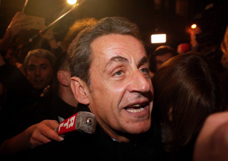 Former French President Nicolas Sarkozy arrives at his headquarters, in Paris, Saturday, Nov. 29, 2014. Sarkozy had been widely expected to win the Union for a Popular Movement leadership in the vote by party members Saturday. The 59-year-old Gaullist collected 64.5 percent of the vote to defeat former government ministers Bruno Le Maire and Herve Mariton. (AP Photo/Thibault Camus) Former French President Nicolas Sarkozy arrives at his headquarters, in Paris, Saturday, Nov. 29, 2014. Sarkozy had been widely expected to win the Union for a Popular Movement leadership in the vote by party members Saturday. The 59-year-old Gaullist collected 64.5 percent of the vote to defeat former government ministers Bruno Le Maire and Herve Mariton. (AP Photo/Thibault Camus)