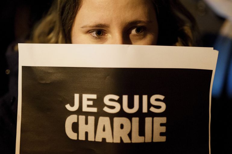 MADRID, SPAIN - JANUARY 07: A woman holds a placard reading 'Je Suis Charli' (I am Charlie) during a gathering of people showing their support for the victims of the terrorist attack at French magazine Charlie Hebdo, in front of the Embassy of France on January 7, 2015 in Madrid, Spain. Twelve people were killed, including two police officers, as two gunmen opened fire at the magazine offices of Charlie Hebdo in Paris, France. (Photo by Pablo Blazquez Dominguez/Getty Images) MADRID, SPAIN - JANUARY 07: A woman holds a placard reading 'Je Suis Charli' (I am Charlie) during a gathering of people showing their support for the victims of the terrorist attack at French magazine Charlie Hebdo, in front of the Embassy of France on January 7, 2015 in Madrid, Spain. Twelve people were killed, including two police officers, as two gunmen opened fire at the magazine offices of Charlie Hebdo in Paris, France. (Photo by Pablo Blazquez Dominguez/Getty Images)