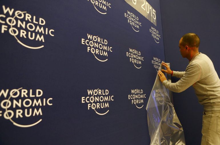 A worker sets up logos of the World Economic Forum (WEF) at the congress center in the Swiss mountain resort of Davos January 20, 2015. More than 1,500 business leaders and 40 heads of state or government will attend the January 21-24 meeting of the WEF to network and discuss big themes, from the price of oil to the future of the Internet. This year they are meeting in the midst of upheaval, with security forces on heightened alert after attacks in Paris, the European Central Bank considering a radical government bond-buying programme and the safe-haven Swiss franc rocketing. REUTERS/Ruben Sprich (SWITZERLAND - Tags: POLITICS BUSINESS) A worker sets up logos of the World Economic Forum (WEF) at the congress center in the Swiss mountain resort of Davos January 20, 2015. More than 1,500 business leaders and 40 heads of state or government will attend the January 21-24 meeting of the WEF to network and discuss big themes, from the price of oil to the future of the Internet. This year they are meeting in the midst of upheaval, with security forces on heightened alert after attacks in Paris, the European Central Bank considering a radical government bond-buying programme and the safe-haven Swiss franc rocketing. REUTERS/Ruben Sprich (SWITZERLAND - Tags: POLITICS BUSINESS)