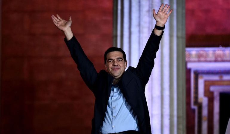 Syriza leader Alexis Tsipras raises his fist as he greets supporters following victory in the election in Athens on January 25, 2015. The left-wing Syriza party led by Alexis Tsipras won Greece's general election after campaigning on a pledge to renegotiate the country's international bailout and reverse years of spending cuts and painful economic reforms.
AFP PHOTO / ARIS MESSINIS Syriza leader Alexis Tsipras raises his fist as he greets supporters following victory in the election in Athens on January 25, 2015. The left-wing Syriza party led by Alexis Tsipras won Greece's general election after campaigning on a pledge to renegotiate the country's international bailout and reverse years of spending cuts and painful economic reforms.
AFP PHOTO / ARIS MESSINIS