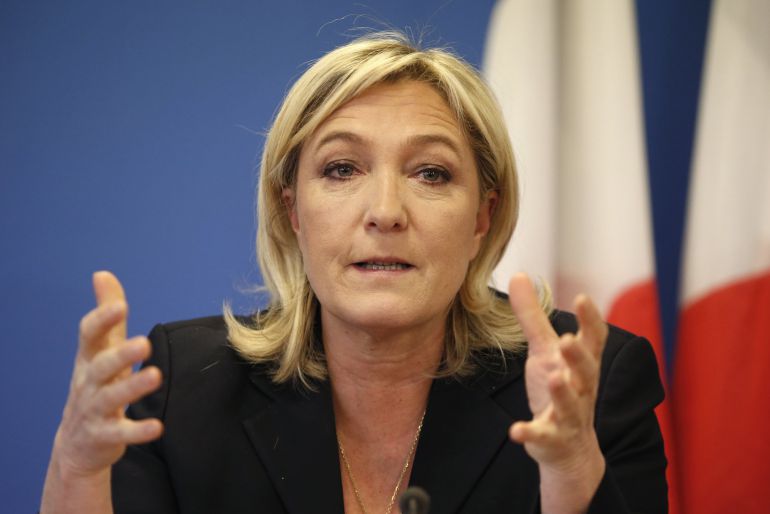 France's National Front political party head Marine Le Pen gestures as she speaks during a news conference at the party headquarters in Nanterre near Paris February 6, 2015. REUTERS/Charles Platiau (FRANCE - Tags: POLITICS) France's National Front political party head Marine Le Pen gestures as she speaks during a news conference at the party headquarters in Nanterre near Paris February 6, 2015. REUTERS/Charles Platiau (FRANCE - Tags: POLITICS)
