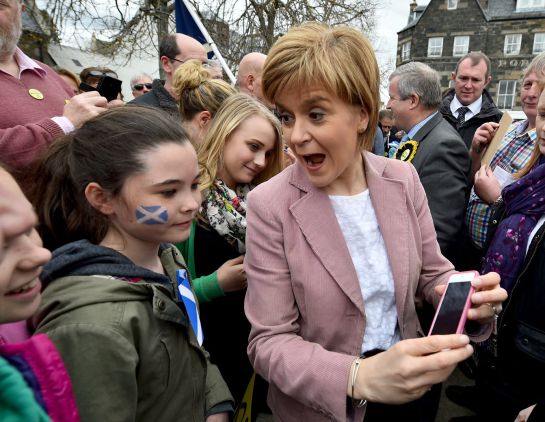 PORTREE, SCOTLAND - MAY 02: First Minister and leader of the SNP Nicola Sturgeon visits Portree on the Isle of Skye by helicopter as she campaigns on May 2, 2015 in Portree, Scotland. As she continued her helicopter tour of Scotland, First Minister Nicola Sturgeon said that Ed Milibands revelation that he is prepared to let the Tories back into office rather than work with the SNP has shown that it is only the SNP that can be trusted to deliver progressive politics. (Photo by Jeff J Mitchell/Getty Images) PORTREE, SCOTLAND - MAY 02: First Minister and leader of the SNP Nicola Sturgeon visits Portree on the Isle of Skye by helicopter as she campaigns on May 2, 2015 in Portree, Scotland. As she continued her helicopter tour of Scotland, First Minister Nicola Sturgeon said that Ed Milibands revelation that he is prepared to let the Tories back into office rather than work with the SNP has shown that it is only the SNP that can be trusted to deliver progressive politics. (Photo by Jeff J Mitchell/Getty Images)
