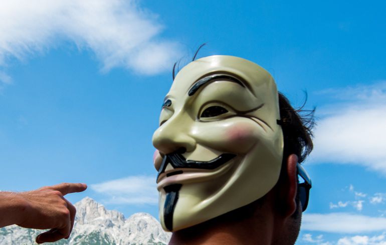 A man wears a Guy Fawkes mask during a demonstration against the Bilderberg conference in Telfs, Austria, on June 13, 2015. The Bilderberg group, which brings together international leaders from politics, high finance, business and academia holds its highly exclusive annual meeting in a luxury hotel in the Austrian Alps. AFP PHOTO / CHRISTIAN BRUNA A man wears a Guy Fawkes mask during a demonstration against the Bilderberg conference in Telfs, Austria, on June 13, 2015. The Bilderberg group, which brings together international leaders from politics, high finance, business and academia holds its highly exclusive annual meeting in a luxury hotel in the Austrian Alps. AFP PHOTO / CHRISTIAN BRUNA