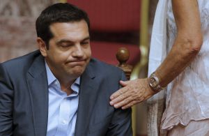 Greek Prime Minister Alexis Tsipras reacts as he attends a parliamentary session in Athens, Greece, August 14, 2015. Tsipras confronted a widening rebellion within his leftist Syriza party as parliament voted to approve the country's third financial rescue by foreign creditors in five years. REUTERS/Christian Hartmann Greek Prime Minister Alexis Tsipras reacts as he attends a parliamentary session in Athens, Greece, August 14, 2015. Tsipras confronted a widening rebellion within his leftist Syriza party as parliament voted to approve the country's third financial rescue by foreign creditors in five years. REUTERS/Christian Hartmann