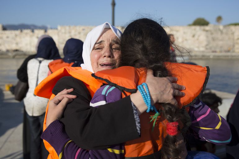 KOS, GREECE - AUGUST 30: A Syrian woman embraces a child after arriving on Kos in an inflatable dinghy on August 30, 2015 in Kos, Greece. Migrants from many parts of the Middle East and African nations continue to flood into Europe before heading from Athens, north to the Macedonian border. Since the beginning of 2015 the number of migrants using the so-called 'Balkans route' has exploded with migrants arriving in Greece from Turkey and then travelling on through Macedonia and Serbia before entering the EU via Hungary. The number of people leaving their homes in war torn countries such as Syria, marks the largest migration of people since World War II. (Photo by Dan Kitwood/Getty Images) KOS, GREECE - AUGUST 30: A Syrian woman embraces a child after arriving on Kos in an inflatable dinghy on August 30, 2015 in Kos, Greece. Migrants from many parts of the Middle East and African nations continue to flood into Europe before heading from Athens, north to the Macedonian border. Since the beginning of 2015 the number of migrants using the so-called 'Balkans route' has exploded with migrants arriving in Greece from Turkey and then travelling on through Macedonia and Serbia before entering the EU via Hungary. The number of people leaving their homes in war torn countries such as Syria, marks the largest migration of people since World War II. (Photo by Dan Kitwood/Getty Images)