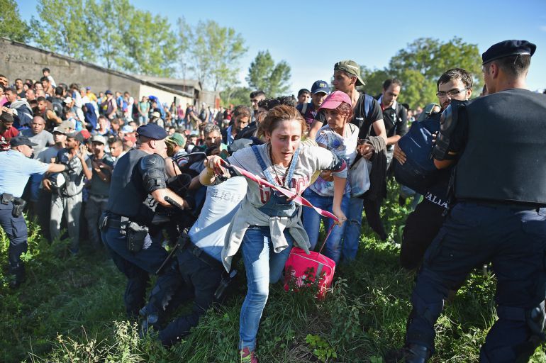 TOVARNIK, CROATIA - SEPTEMBER 17: Migrants force their way through police lines at Tovarnik station to board a train bound for Zagreb on September 17, 2015 in Tovarnik, Croatia. Migrants are now diverting to Croatia from Serbia after Hungary closed its border with Serbia, with the majority of them trying to reach Germany amid divisions within the European Union over how to manage the ongoing crisis. (Photo by Jeff J Mitchell/Getty Images) TOVARNIK, CROATIA - SEPTEMBER 17: Migrants force their way through police lines at Tovarnik station to board a train bound for Zagreb on September 17, 2015 in Tovarnik, Croatia. Migrants are now diverting to Croatia from Serbia after Hungary closed its border with Serbia, with the majority of them trying to reach Germany amid divisions within the European Union over how to manage the ongoing crisis. (Photo by Jeff J Mitchell/Getty Images)