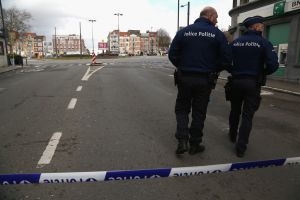 BRUSSELS, BELGIUM - MARCH 25: Police officers guard a cordoned-off area during a raid off of Place General Meiser in the Schaarbeek (Schaerbeek in French) district on March 25, 2016, in Brussels, Belgium. Explosions from police flash grenades and bomb disposal units were heard by neighbors and a suspect was shot in the leg and taken into custody during the operation, which was related to the arrest of 34-year-old Reda Kriket in Paris, who had been found with explosives and weapons in his apartment expected to be used for a foiled terrorist plot. Earlier in the week in the same neighborhood as the raid, police discovered bomb-making material in an apartment used by the suicide bombers carrying out the attacks at Brussels Zaventem airport and Maelbeek/Maalbeek train station that killed at least 34 people and injured over 300. (Photo by Adam Berry/Getty Images) BRUSSELS, BELGIUM - MARCH 25: Police officers guard a cordoned-off area during a raid off of Place General Meiser in the Schaarbeek (Schaerbeek in French) district on March 25, 2016, in Brussels, Belgium. Explosions from police flash grenades and bomb disposal units were heard by neighbors and a suspect was shot in the leg and taken into custody during the operation, which was related to the arrest of 34-year-old Reda Kriket in Paris, who had been found with explosives and weapons in his apartment expected to be used for a foiled terrorist plot. Earlier in the week in the same neighborhood as the raid, police discovered bomb-making material in an apartment used by the suicide bombers carrying out the attacks at Brussels Zaventem airport and Maelbeek/Maalbeek train station that killed at least 34 people and injured over 300. (Photo by Adam Berry/Getty Images)