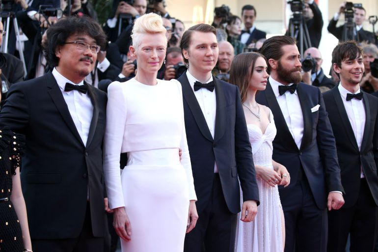 Director Bong Joon-Ho, Paul Dano, Lily Collins, Jake Gyllenhaal and Steven Yeun attend the "Okja" screening during the 70th annual Cannes Film Festival at Palais des Festivals on May 19, 2017 in Cannes, France Director Bong Joon-Ho, Paul Dano, Lily Collins, Jake Gyllenhaal and Steven Yeun attend the "Okja" screening during the 70th annual Cannes Film Festival at Palais des Festivals on May 19, 2017 in Cannes, France