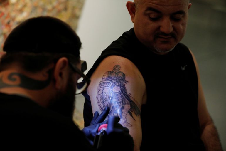 Gabi Shoval, who lost his leg during military combat while serving as a soldier in the Israeli army, gets a tattoo done by Israeli artist Alexey Zamotevsky as part of the "Healing Ink " project, at the Israel Museum in Jerusalem October 9, 2017. Picture taken October 9, 2017. REUTERS-Amir Cohen Gabi Shoval, who lost his leg during military combat while serving as a soldier in the Israeli army, gets a tattoo done by Israeli artist Alexey Zamotevsky as part of the "Healing Ink " project, at the Israel Museum in Jerusalem October 9, 2017. Picture taken October 9, 2017. REUTERS-Amir Cohen