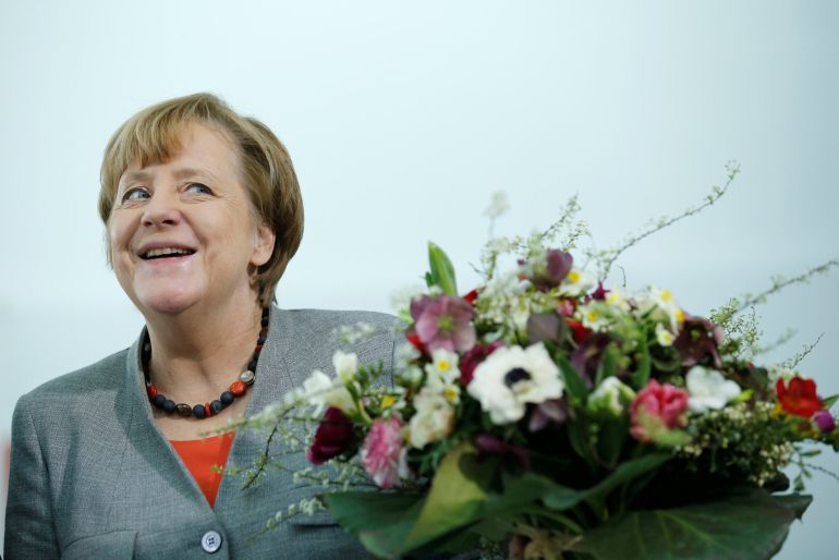 Chancellor Angela Merkel receives Valentine's Day flowers from the Central Gardening Association at the Chancellery in Berlin, Germany Chancellor Angela Merkel receives Valentine's Day flowers from the Central Gardening Association at the Chancellery in Berlin, Germany