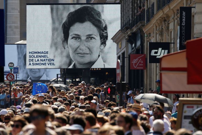 People gather near the Pantheon before a national tribute to late Auschwitz survivor and French health minister Simone Veil and her late husband Antoine Veil in Paris, France, July 1, 2018. People gather near the Pantheon before a national tribute to late Auschwitz survivor and French health minister Simone Veil and her late husband Antoine Veil in Paris, France, July 1, 2018.