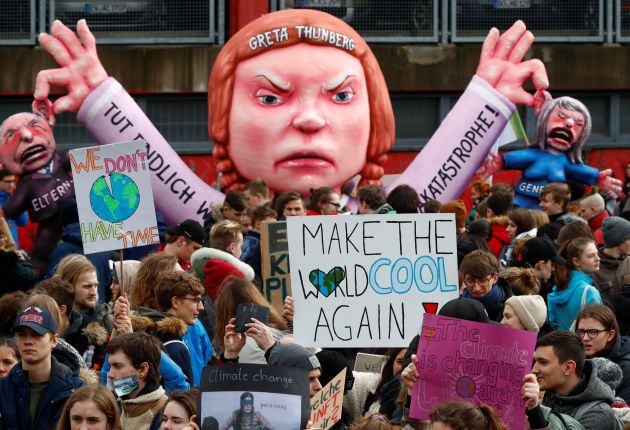 Students use a carnival float depicting Swedish environmental campaigner Greta Thunberg during a strike from school to demand action on climate change at the town hall square of Duesseldorf, Germany, March 15, 2019 Students use a carnival float depicting Swedish environmental campaigner Greta Thunberg during a strike from school to demand action on climate change at the town hall square of Duesseldorf, Germany, March 15, 2019