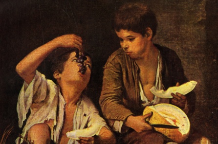 Niños comiendo uvas y melón Niños comiendo uvas y melón