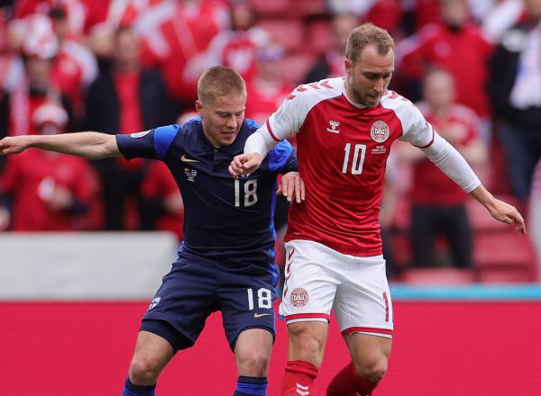 COPENHAGEN, DENMARK - JUNE 12: Christian Eriksen of Denmark battles for possession with Jere Uronen of Finland during the UEFA Euro 2020 Championship Group B match between Denmark and Finland on June 12, 2021 in Copenhagen, Denmark. (Photo by Friedemann Vogel - Pool/Getty Images)