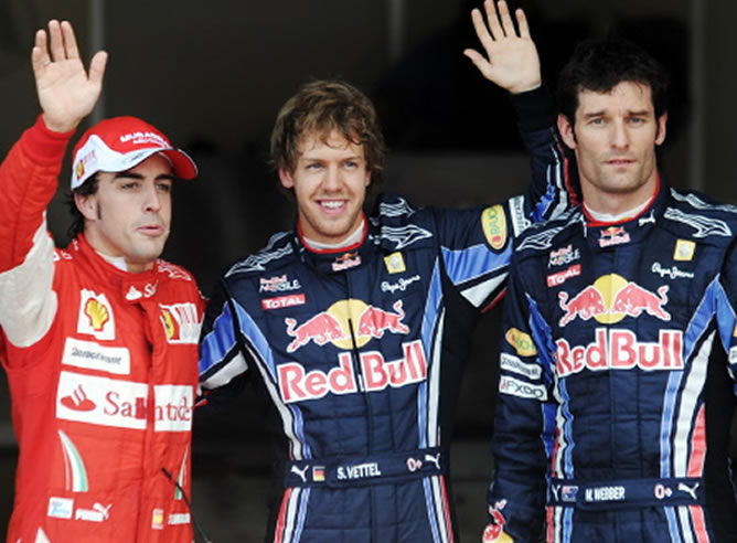 Vettel, Webber y Alonso tras la sesión de clasificación en Silverstone / AFP Vettel, Webber y Alonso tras la sesión de clasificación en Silverstone / AFP