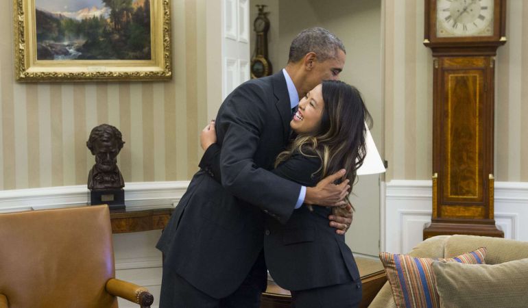 US President Barack Obama hugs nurse Nina Pham, who was declared free of the Ebola virus after contracting the disease while caring for a Liberian patient in Texas, during a meeting in the Oval Office of the White House in Washington, DC, October 24, 2014. AFP PHOTO / Saul LOEB US President Barack Obama hugs nurse Nina Pham, who was declared free of the Ebola virus after contracting the disease while caring for a Liberian patient in Texas, during a meeting in the Oval Office of the White House in Washington, DC, October 24, 2014. AFP PHOTO / Saul LOEB
