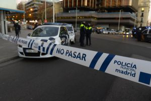 Spanish policemen stand at the entrance of Genova street close to the Spanish Popular Party's headquarters after a man runned his car with two gas cylinders into the political party's building, in Madrid on December 19, 2014. The area in central Madrid was shut off by police as bomb disposal experts examine the car, and the driver, a Spanish buisnessman was arrested, no one was injured. AFP PHOTO/ GERARD JULIEN Spanish policemen stand at the entrance of Genova street close to the Spanish Popular Party's headquarters after a man runned his car with two gas cylinders into the political party's building, in Madrid on December 19, 2014. The area in central Madrid was shut off by police as bomb disposal experts examine the car, and the driver, a Spanish buisnessman was arrested, no one was injured. AFP PHOTO/ GERARD JULIEN