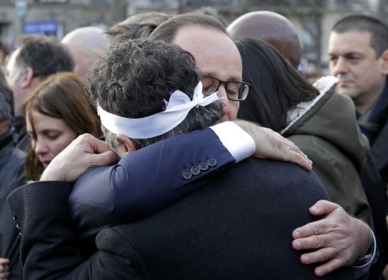 French President Francois Hollande (R) comforts French columnist for Charlie Hebdo Patrick Pelloux as they take part with family members and relatives in a solidarity march (Marche Republicaine) in the streets of Paris January 11, 2015. Hundreds of thousands of French citizens will be joined by dozens of foreign leaders, among them Arab and Muslim representatives, in a march on Sunday in an unprecedented tribute to this week's victims, including journalists and policemen, following the shootings by gunmen at the offices of the satirical weekly newspaper Charlie Hebdo, the killing of a police woman in Montrouge, and the hostage taking at a kosher supermarket at the Porte de Vincennes. REUTERS/Philippe Wojazer (FRANCE - Tags: CRIME LAW POLITICS CIVIL UNREST SOCIETY) French President Francois Hollande (R) comforts French columnist for Charlie Hebdo Patrick Pelloux as they take part with family members and relatives in a solidarity march (Marche Republicaine) in the streets of Paris January 11, 2015. Hundreds of thousands of French citizens will be joined by dozens of foreign leaders, among them Arab and Muslim representatives, in a march on Sunday in an unprecedented tribute to this week's victims, including journalists and policemen, following the shootings by gunmen at the offices of the satirical weekly newspaper Charlie Hebdo, the killing of a police woman in Montrouge, and the hostage taking at a kosher supermarket at the Porte de Vincennes. REUTERS/Philippe Wojazer (FRANCE - Tags: CRIME LAW POLITICS CIVIL UNREST SOCIETY)
