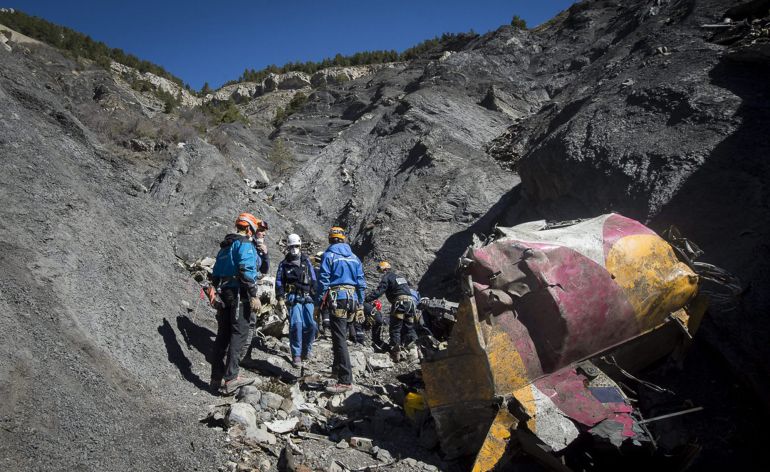 Rescue workers and investigators, seen in this picture made available to the media by the French Interior Ministry April 1, 2015, work near debris from wreckage at the crash site of a Germanwings Airbus A320, near Seyne-les-Alpes. The German pilot, Andreas Lubitz, 27, who crashed a plane in the French Alps last week, killing 150 people, told officials at a Lufthansa training school in 2009 that he had gone through a period of severe depression, the airline said on Tuesday. REUTERS/French Interior Ministry/DICOM/Y. Malenfer/Handout TPX IMAGES OF THE DAY NO ARCHIVES. FOR EDITORIAL USE ONLY. NOT FOR SALE FOR MARKETING OR ADVERTISING CAMPAIGNS. THIS IMAGE HAS BEEN SUPPLIED BY A THIRD PARTY. IT IS DISTRIBUTED, EXACTLY AS RECEIVED BY REUTERS, AS A SERVICE TO CLIENTS Rescue workers and investigators, seen in this picture made available to the media by the French Interior Ministry April 1, 2015, work near debris from wreckage at the crash site of a Germanwings Airbus A320, near Seyne-les-Alpes. The German pilot, Andreas Lubitz, 27, who crashed a plane in the French Alps last week, killing 150 people, told officials at a Lufthansa training school in 2009 that he had gone through a period of severe depression, the airline said on Tuesday. REUTERS/French Interior Ministry/DICOM/Y. Malenfer/Handout TPX IMAGES OF THE DAY NO ARCHIVES. FOR EDITORIAL USE ONLY. NOT FOR SALE FOR MARKETING OR ADVERTISING CAMPAIGNS. THIS IMAGE HAS BEEN SUPPLIED BY A THIRD PARTY. IT IS DISTRIBUTED, EXACTLY AS RECEIVED BY REUTERS, AS A SERVICE TO CLIENTS