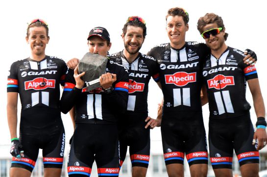 Team Giant-Alpecin German cyclist John Degenkolb (2L) celebrates with teammates on the podium after winning the 113th edition of the Paris-Roubaix Paris-Roubaix one-day classic cycling race in Roubaix on April 12, 2015. AFP PHOTO / FRANCOIS LO PRESTI Team Giant-Alpecin German cyclist John Degenkolb (2L) celebrates with teammates on the podium after winning the 113th edition of the Paris-Roubaix Paris-Roubaix one-day classic cycling race in Roubaix on April 12, 2015. AFP PHOTO / FRANCOIS LO PRESTI