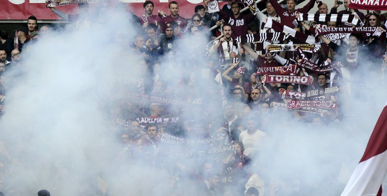 Torino's supporters look on as a firework explode during their Italian Serie A soccer match against Juventus at Olympic Stadium in Turin April 26, 2015. REUTERS/Giorgio Perottino Torino's supporters look on as a firework explode during their Italian Serie A soccer match against Juventus at Olympic Stadium in Turin April 26, 2015. REUTERS/Giorgio Perottino