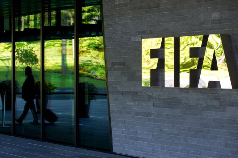 ZURICH, SWITZERLAND - JUNE 03: A FIFA logo sits next to the entrance at the FIFA headquarters on June 3, 2015 in Zurich, Switzerland. Joseph S. Blatter resigned as president of FIFA. The 79-year-old Swiss official, FIFA president for 17 years said a special congress would be called to elect a successor. (Photo by Philipp Schmidli/Getty Images) ZURICH, SWITZERLAND - JUNE 03: A FIFA logo sits next to the entrance at the FIFA headquarters on June 3, 2015 in Zurich, Switzerland. Joseph S. Blatter resigned as president of FIFA. The 79-year-old Swiss official, FIFA president for 17 years said a special congress would be called to elect a successor. (Photo by Philipp Schmidli/Getty Images)