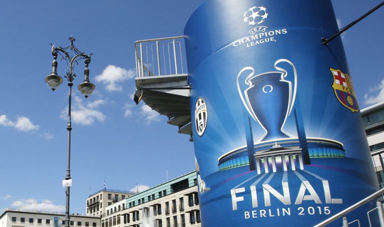 People walk past the Brandenburg gate at the UEFA Champions Festival in Berlin, Germany, June 4, 2015. The Olympic stadium will host Saturday's Champions League final between Barcelona and Juventus in Berlin. REUTERS/Fabrizio Bensch People walk past the Brandenburg gate at the UEFA Champions Festival in Berlin, Germany, June 4, 2015. The Olympic stadium will host Saturday's Champions League final between Barcelona and Juventus in Berlin. REUTERS/Fabrizio Bensch