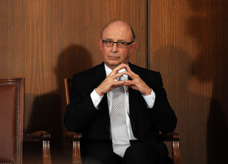 Spanish Minister of the Treasury and Public Administrations Cristobal Montoro sits during the investiture ceremony for the new President of regional government of Andalusia in the "Usos Multiples del Parlamento" room at the Parliament in Sevilla on June 14, 2015. Diaz took office as president of the regional government of Andalusia almost three months of stalemate after winning the elections marked by lengthy negotiations to reach an agreement with the Spanish emerging parties. AFP PHOTO / CRISTINA QUICLER Spanish Minister of the Treasury and Public Administrations Cristobal Montoro sits during the investiture ceremony for the new President of regional government of Andalusia in the "Usos Multiples del Parlamento" room at the Parliament in Sevilla on June 14, 2015. Diaz took office as president of the regional government of Andalusia almost three months of stalemate after winning the elections marked by lengthy negotiations to reach an agreement with the Spanish emerging parties. AFP PHOTO / CRISTINA QUICLER