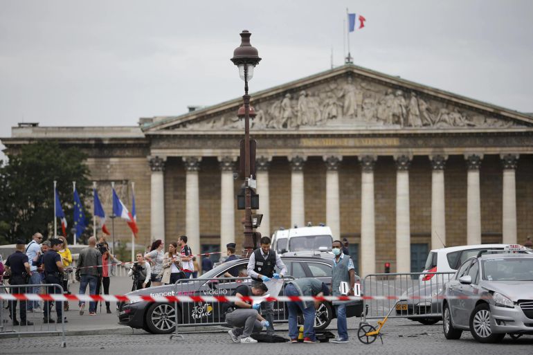 French police look for clues after a car drove through barriers set up for the final stage of the Tour de France in central Paris, France, July 26, 2015. Police opened fire on a car which drove through barriers after refusing to obey them near the Place de la Concorde, Paris police said. Hundreds of thousands of people were expected to gather in the Place de la Concorde and along Champs Elysees avenue for the final leg of the Tour de France later in the day. REUTERS/Stephane Mahe French police look for clues after a car drove through barriers set up for the final stage of the Tour de France in central Paris, France, July 26, 2015. Police opened fire on a car which drove through barriers after refusing to obey them near the Place de la Concorde, Paris police said. Hundreds of thousands of people were expected to gather in the Place de la Concorde and along Champs Elysees avenue for the final leg of the Tour de France later in the day. REUTERS/Stephane Mahe