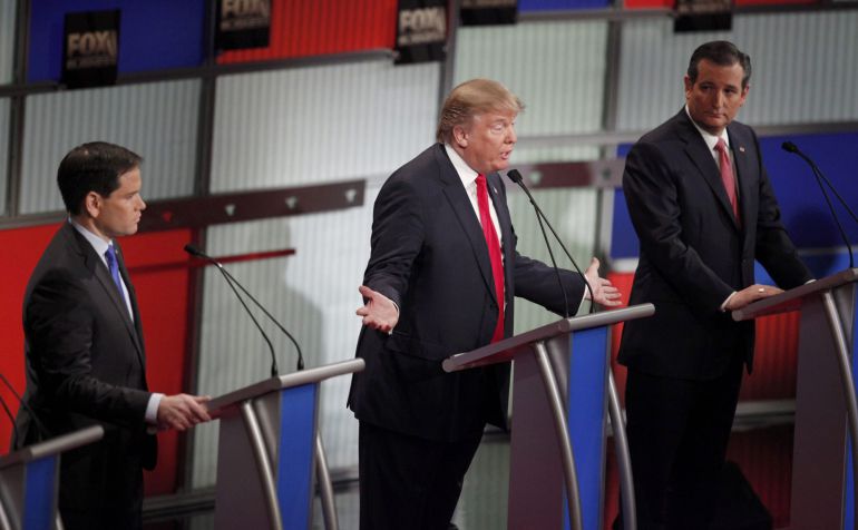 Republican U.S. presidential candidate businessman Donald Trump (C) speaks as rival candidates Senator Marco Rubio and Senator Ted Cruz (R) look on during the Fox Business Network Republican presidential candidates debate in North Charleston, South Carolina, January 14, 2016. REUTERS Randall Hill Republican U.S. presidential candidate businessman Donald Trump (C) speaks as rival candidates Senator Marco Rubio and Senator Ted Cruz (R) look on during the Fox Business Network Republican presidential candidates debate in North Charleston, South Carolina, January 14, 2016. REUTERS Randall Hill