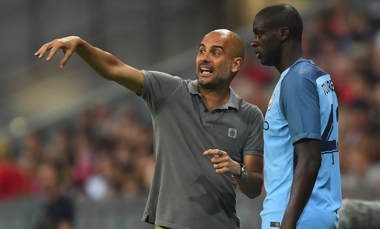 Guardiola y Yaya Touré, en un partido del City. Guardiola y Yaya Touré, en un partido del City.