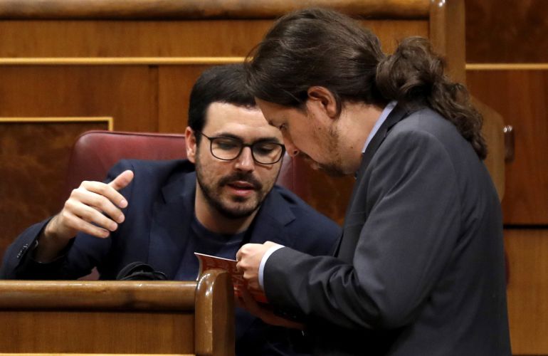 El líder de Podemos, Pablo Iglesias, y el coordinador general de Izquierda Unida, Alberto Garzón. El líder de Podemos, Pablo Iglesias, y el coordinador general de Izquierda Unida, Alberto Garzón.