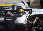 Formula One F1 - Malaysia Grand Prix 2017 - Sepang, Malaysia - September 30, 2017. Mercedes’ Lewis Hamilton interacts with crew members at the pit during practice. REUTERS/Edgar Su