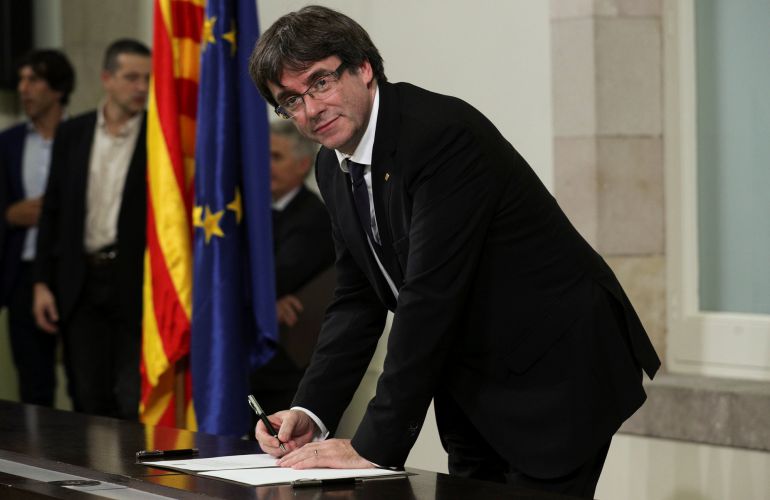 Catalan President Carles Puigdemont signs a declaration of independence Catalan President Carles Puigdemont signs a declaration of independence