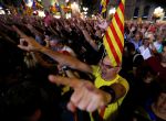 People raise their arms during celebrations in Sant Jaume square after the Catalan regional parliament declared independence from Spain in Barcelona, Spain, October 27, 2017. REUTERS/Yves Herman