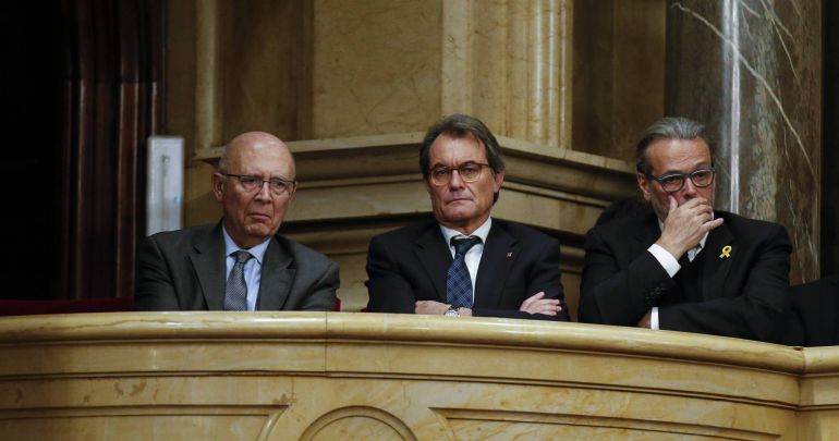 Artur Mas (C) looks on during an investiture session at Catalonia's regional parliament in Barcelona Artur Mas (C) looks on during an investiture session at Catalonia's regional parliament in Barcelona