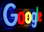 FILE PHOTO: An illuminated Google logo is seen inside an office building in Zurich September 5, 2018. REUTERS/Arnd WIegmann/File Photo