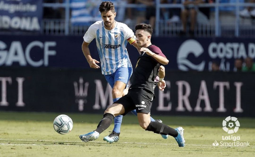 El jugador del Sporting Manu García, durante el partido contra el Málaga El jugador del Sporting Manu García, durante el partido contra el Málaga