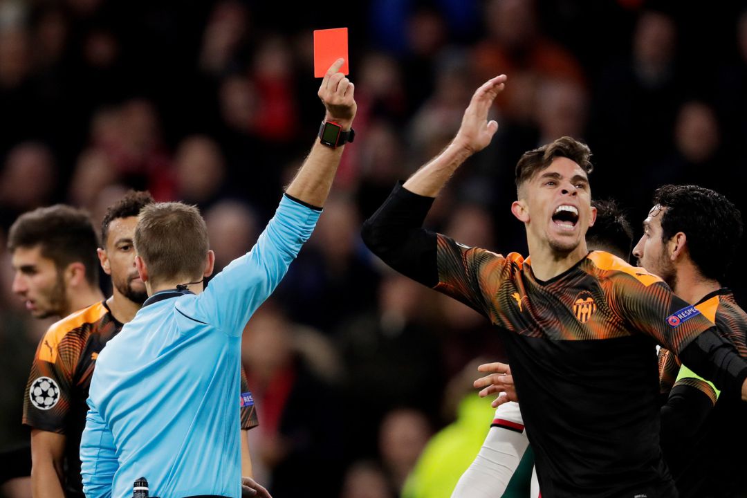 Gabriel Paulista of Valencia, receives a red card from referee Clement Turpin during the UEFA Champions League Gabriel Paulista of Valencia, receives a red card from referee Clement Turpin during the UEFA Champions League