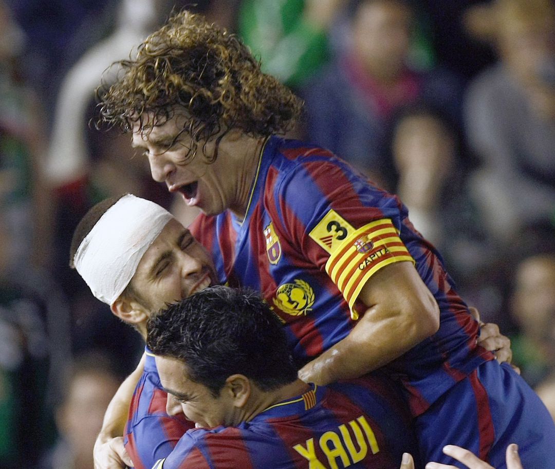 Puyol, Piqué y Xavi celebran un gol Puyol, Piqué y Xavi celebran un gol