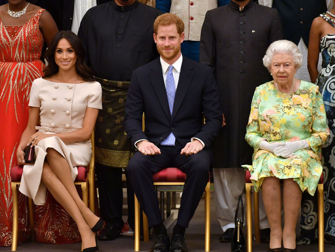 Harry y Meghan junto a la reina Isabel II. Harry y Meghan junto a la reina Isabel II.